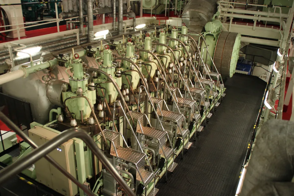 MAN B&W two-stroke marine main engine, cylinder covers and platforms, on a feeder ship