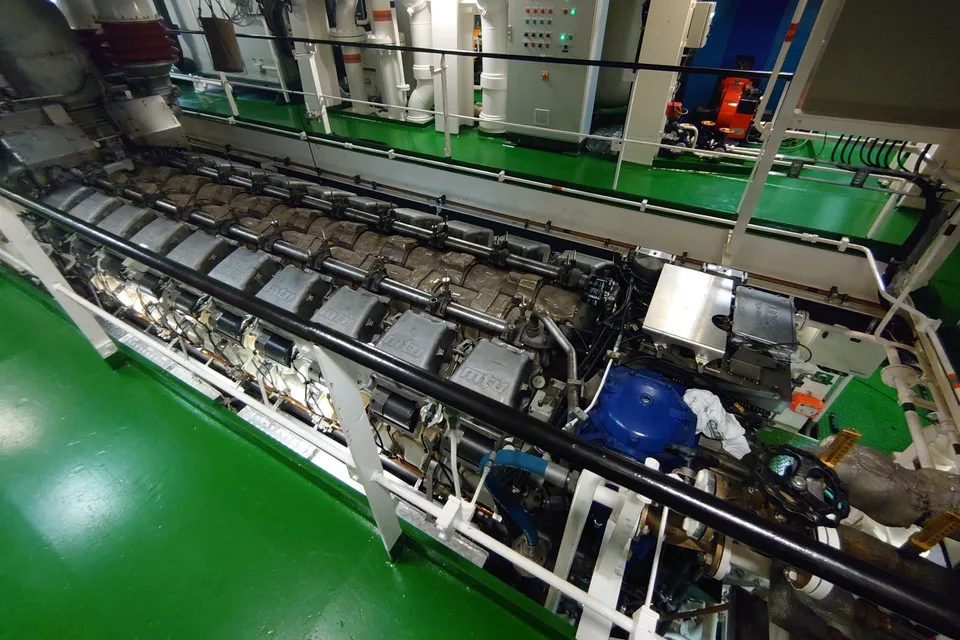 MTU 20V8000 main propulsion engine in a ship engine room, mtu logo cast on each valve cover