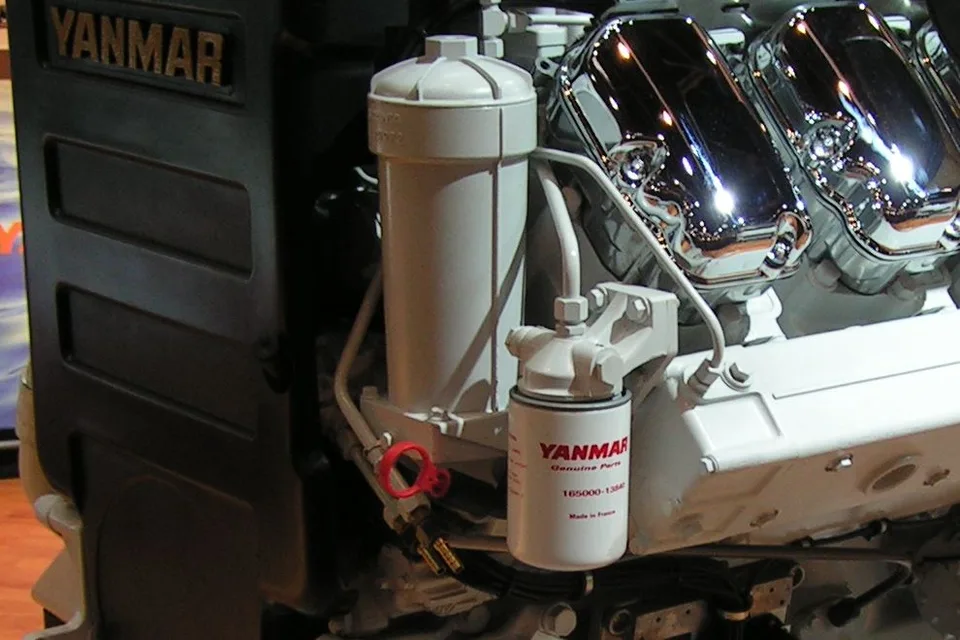 Yanmar 8SY-STP marine diesel engine showing the cast YANMAR badge and a maker-branded oil filter